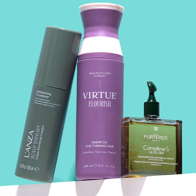 L'ANZA Scalp Therapy Stimulating Treatment spray, Virtue Flourish shampoo for thinning hair and Rene Furterer Complexe 5 scalp oil bottle on a teal background.