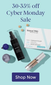 A collection of hair, skin and makeup products that are 30-35% off in a Cyber Monday Sale arranged on a turquoise background with decorative holiday balls.