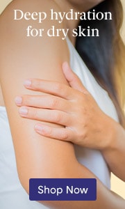 Hand applying white body lotion to arm with text deep hydration for dry skin.