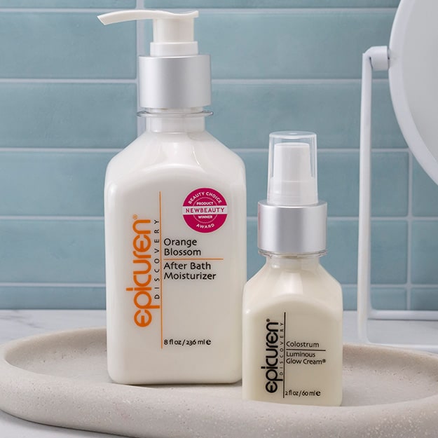 Epicuren Discovery After Bath and Colostrum Luminous Glow Cream on a light background.