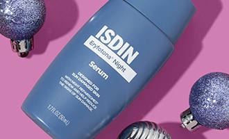 Closeup of ISDIN shiny new skin care product with glittery ornaments