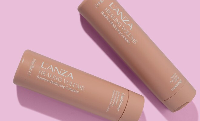 L’ANZA Healing Volume Bamboo Bodying Complex Shampoo and Conditioner lying next to each other