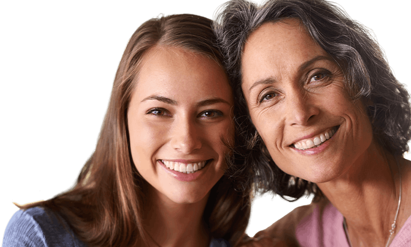 Two smiling women (mother and daughter) posing together against a warm yellow background with a “Mother’s Day Gift Guide” headline.