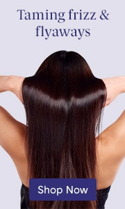 Woman with long smooth dark hair showing frizz-free results
