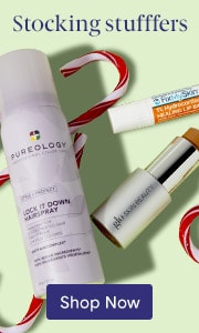 Stocking stuffers and other beauty products with candy cane decorations on light green background