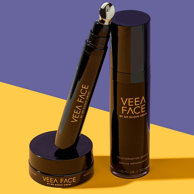 VEEA FACE skin care products displayed on a purple and yellow background
