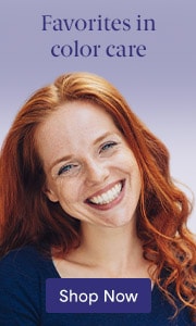 Image of a Caucasian woman with auburn hair on light purple background. Shop color hair care products on LovelySkin.com