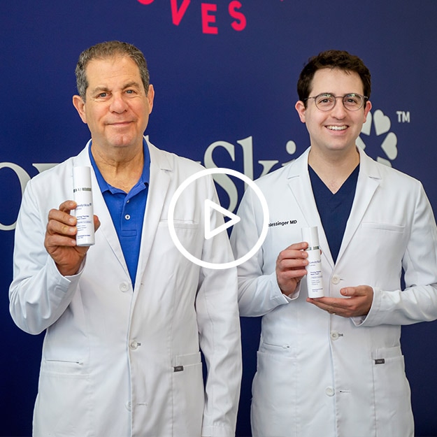 Video thumbnail of Dr. Joel and Dr. Daniel Schlessinger holding LovelySkin LUXE products in front of a LovelySkin backdrop.