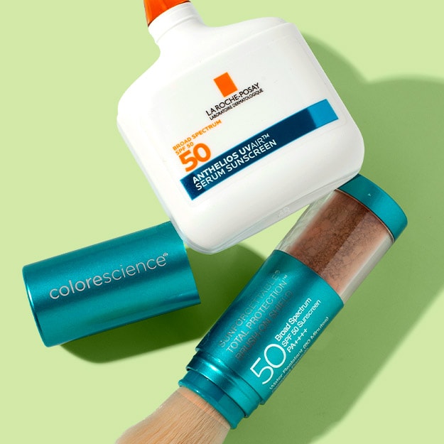 La Roche-Posay sunscreen serum and Colorescience sunscreen brush displayed together