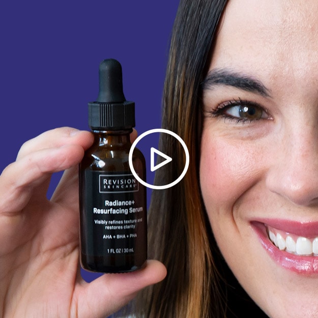 Woman holding Revision Skincare Serum on dark blue background