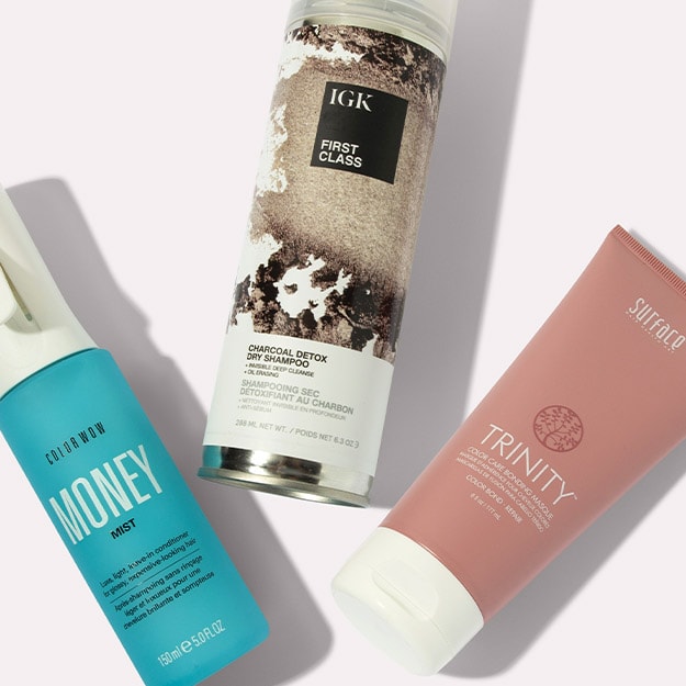  Assortment of hair care products from IGK, Color wow and Surface, on a neutral background.