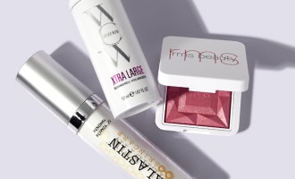 Collection of beauty products and other skin care items arranged on white surface