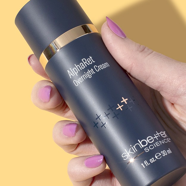 Yellow background featuring skinbetter science AlphaRet Overnight Cream.