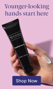 Hand holding Revision Skincare Youthful hands tube with text Younger-looking hands start here.