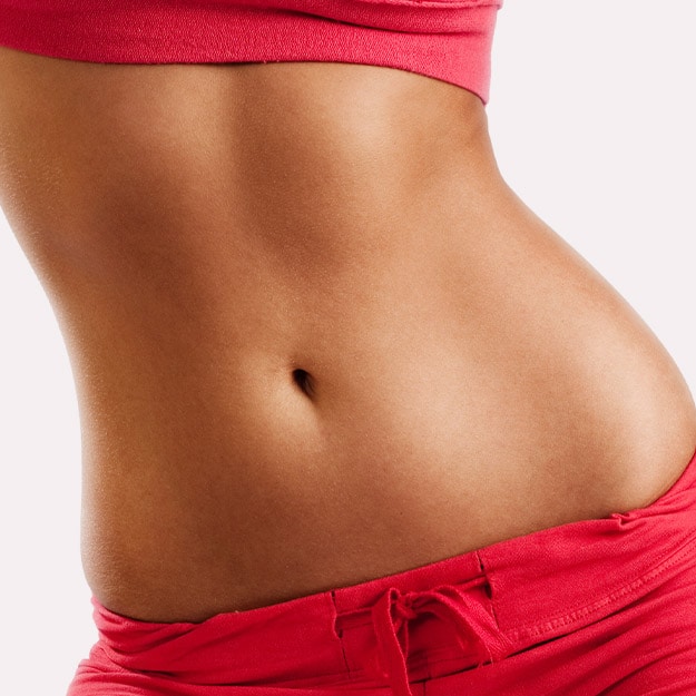 Woman with a toned abdomen on white background